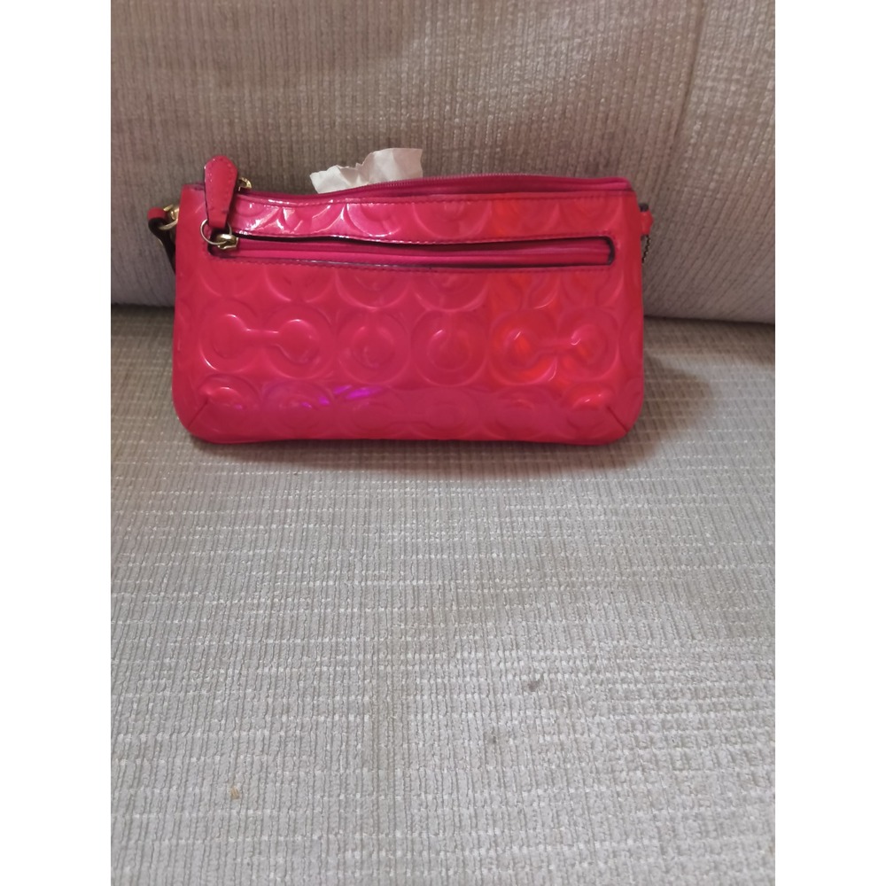 54. Coach Hot Pink Patent Leather Signature C Embossed Wristlet Clutch Bag